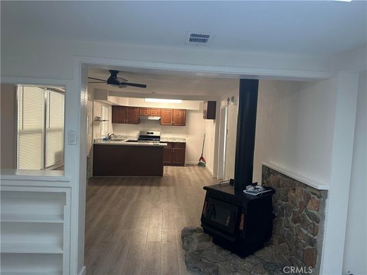 Fireplace, Interior, Kitchen, Stainless Steel Appliances, Wood Texture Flooring
