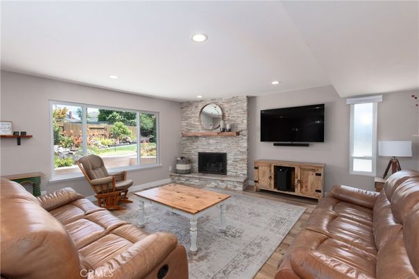 Fireplace, Interior, Living room, Recessed Lighting, Stone Walls, Wood Texture Flooring