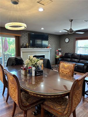 Dining room, Fireplace, Interior, Living room, Pendant Lights, Recessed Lighting, Stone Walls, Wood Texture Flooring