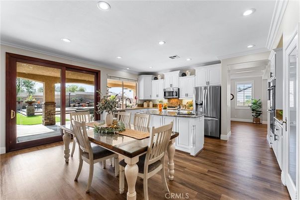 Dining room, Interior, Kitchen, Recessed Lighting, Stainless Steel Appliances, Wood Texture Flooring
