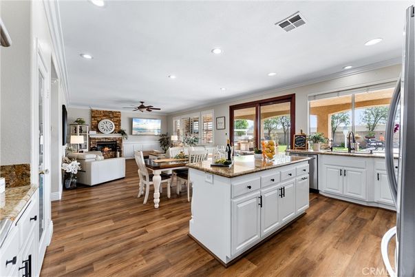 Dining room, Fireplace, Interior, Kitchen, Living room, Recessed Lighting, Wood Texture Flooring