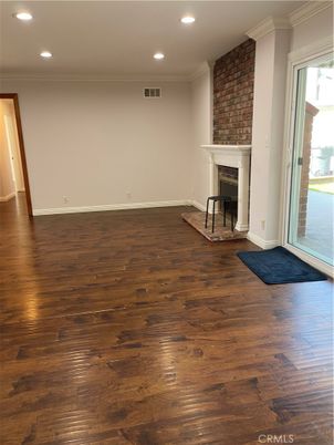 Empty room, Fireplace, Interior, Recessed Lighting, Stone Walls, Wood Texture Flooring