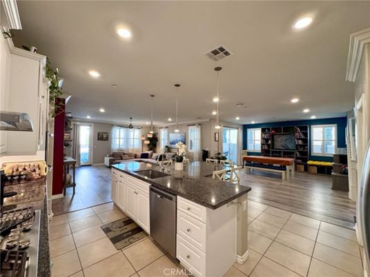 Fireplace, Interior, Kitchen, Living room, Pendant Lights, Recessed Lighting, Stainless Steel Appliances, Wood Texture Flooring