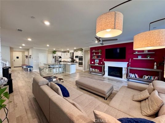 Fireplace, Interior, Kitchen, Living room, Pendant Lights, Recessed Lighting, Stainless Steel Appliances, Wood Texture Flooring
