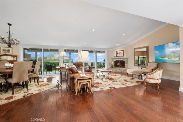 Chandelier, Dining room, Fireplace, Interior, Living room, Recessed Lighting, Wood Texture Flooring