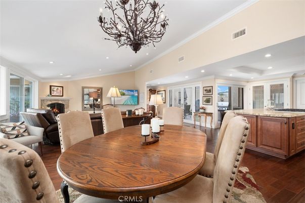 Chandelier, Dining room, Fireplace, Interior, Living room, Recessed Lighting, Wood Texture Flooring