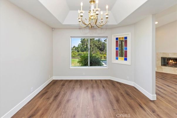 Chandelier, Empty room, Fireplace, Interior, Recessed Lighting, Wood Texture Flooring