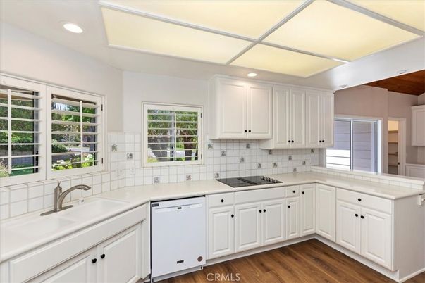 Interior, Kitchen, Recessed Lighting, Tile Countertops, Wood Texture Flooring