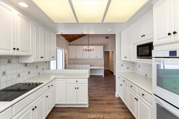 Chandelier, Interior, Kitchen, Recessed Lighting, Tile Countertops, Wooden Ceilings, Wood Texture Flooring