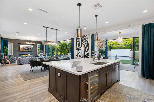 Chandelier, Dining room, Fireplace, Interior, Kitchen, Living room, Pendant Lights, Recessed Lighting, Wood Texture Flooring