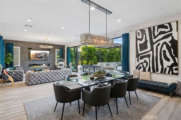 Chandelier, Dining room, Fireplace, Interior, Living room, Pendant Lights, Recessed Lighting, Wood Texture Flooring