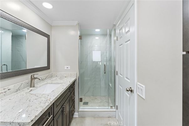 Bathroom, Dual Sink Vanities, Glass Shower, Interior, Marble Walls, Recessed Lighting