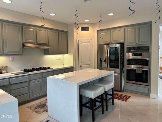 Interior, Kitchen, Marble Walls, Recessed Lighting, Stainless Steel Appliances