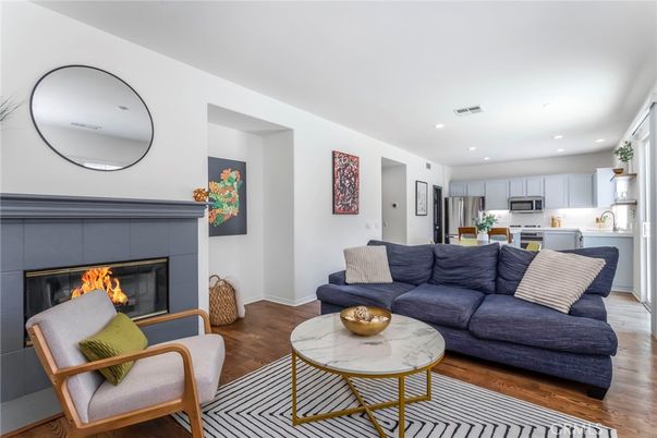 Fireplace, Interior, Kitchen, Living room, Recessed Lighting, Stainless Steel Appliances, Wood Texture Flooring