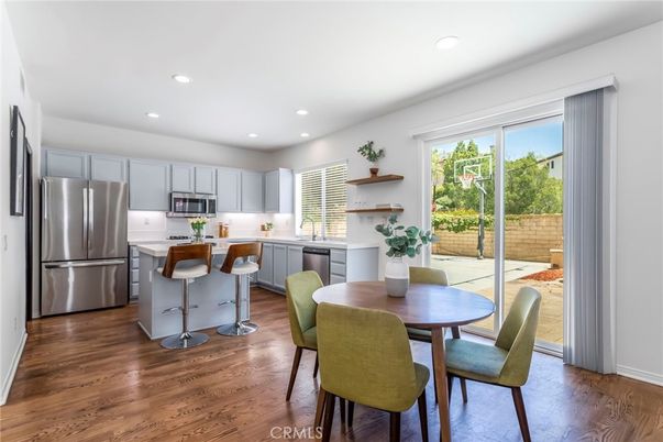 Dining room, Interior, Kitchen, Recessed Lighting, Stainless Steel Appliances, Wood Texture Flooring