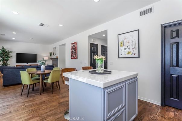 Dining room, Interior, Kitchen, Living room, Recessed Lighting, Tile Countertops, Wood Texture Flooring