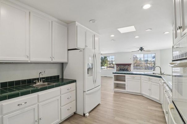 Interior, Kitchen, Recessed Lighting, Tile Countertops, Wood Texture Flooring