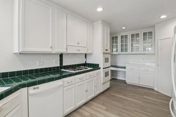 Interior, Kitchen, Recessed Lighting, Tile Countertops, Wood Texture Flooring