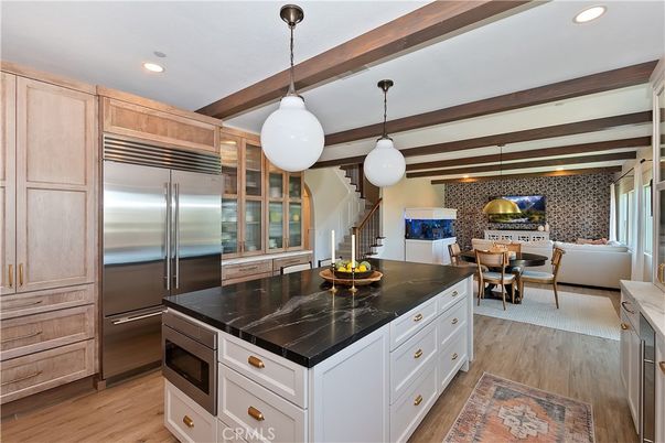 Dining room, Fireplace, Interior, Kitchen, Living room, Pendant Lights, Recessed Lighting, Stainless Steel Appliances, Wooden Beams, Wood Texture Flooring