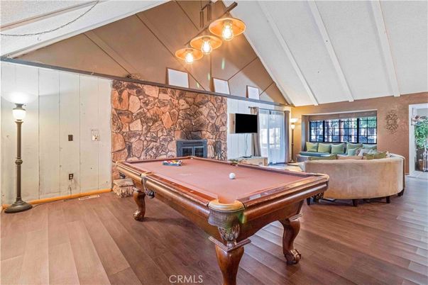 Billiard Table, Fireplace, Game Room, Interior, Pendant Lights, Stone Walls, Wood Texture Flooring