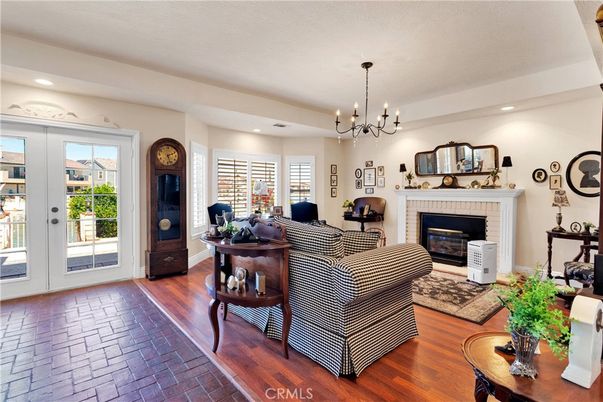 Chandelier, Fireplace, Interior, Living room, Pendant Lights, Recessed Lighting, Wood Texture Flooring