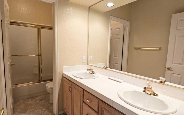 Bathroom, Dual Sink Vanities, Glass Shower, Interior, Recessed Lighting, Tile Countertops