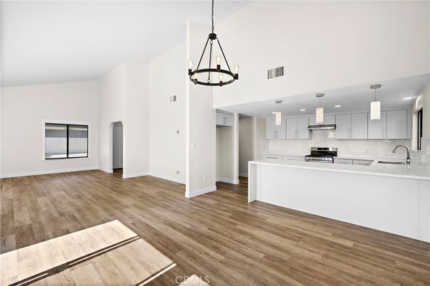 Chandelier, Interior, Kitchen, Pendant Lights, Recessed Lighting, Stainless Steel Appliances, Wood Texture Flooring