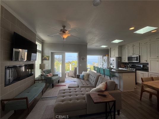 Dining room, Fireplace, Interior, Kitchen, Living room, Recessed Lighting, Stainless Steel Appliances, Wood Texture Flooring