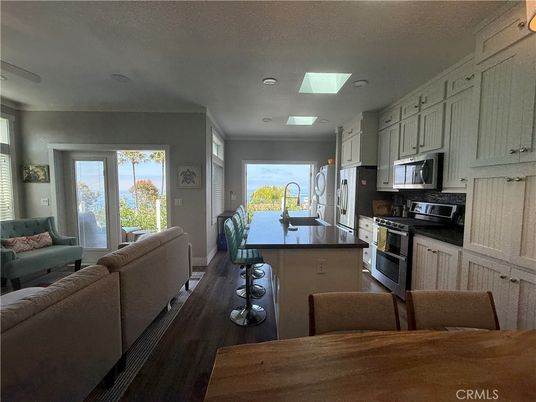 Dining room, Interior, Kitchen, Living room, Recessed Lighting, Stainless Steel Appliances, Wood Texture Flooring