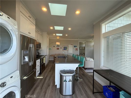 Interior, Kitchen, Recessed Lighting, Washer, Wood Texture Flooring