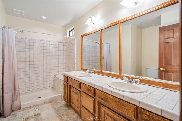 Bathroom, Dual Sink Vanities, Interior, Recessed Lighting, Tile Countertops