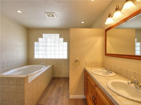 Bathroom, Dual Sink Vanities, Interior, Recessed Lighting, Tile Countertops, Wood Texture Flooring