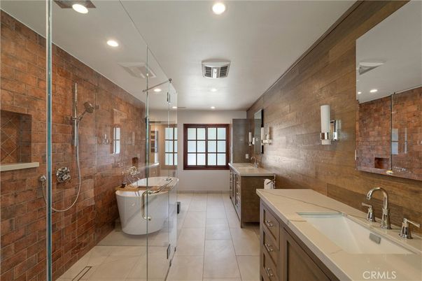 Bathroom, Dual Sink Vanities, Free Standing Baths, Glass Shower, Interior, Recessed Lighting, Stone Walls