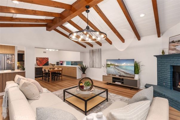 Chandelier, Dining room, Fireplace, Interior, Living room, Pendant Lights, Recessed Lighting, Wooden Beams, Wood Texture Flooring