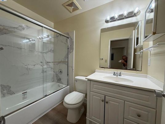Bathroom, Glass Shower, Interior, Marble Walls, Wood Texture Flooring