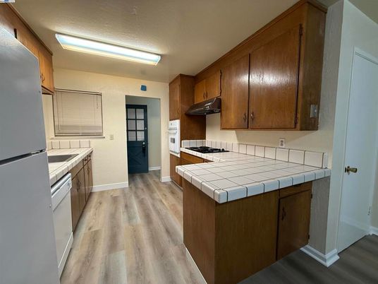 Interior, Kitchen, Tile Countertops, Wood Texture Flooring