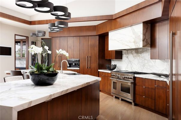 Interior, Kitchen, Marble Walls, Pendant Lights, Stainless Steel Appliances, Wood Texture Flooring