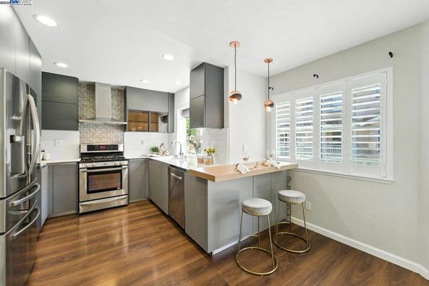 Interior, Kitchen, Pendant Lights, Recessed Lighting, Stainless Steel Appliances, Wood Texture Flooring