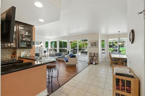 Dining room, Fireplace, Interior, Living room, Pendant Lights, Recessed Lighting, Wood Texture Flooring
