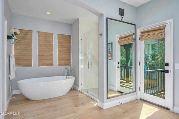 Bathroom, Free Standing Baths, Glass Shower, Interior, Recessed Lighting, Wood Texture Flooring