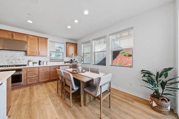 Dining room, Interior, Kitchen, Recessed Lighting, Stainless Steel Appliances, Wood Texture Flooring
