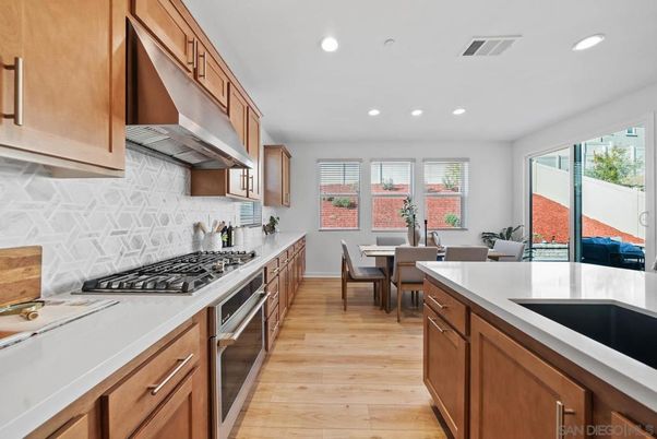 Dining room, Interior, Kitchen, Recessed Lighting, Stainless Steel Appliances, Wood Texture Flooring