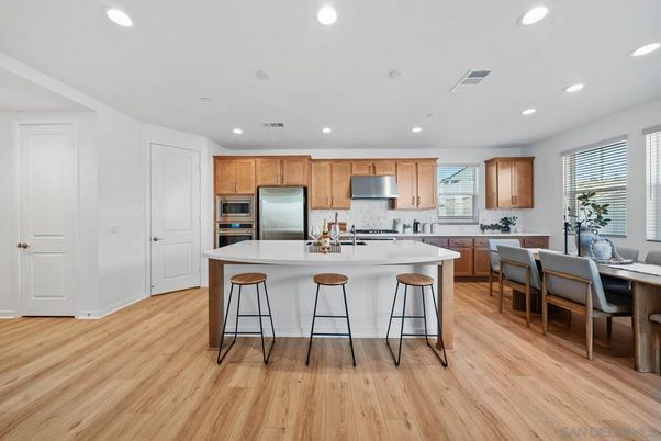 Dining room, Interior, Kitchen, Recessed Lighting, Stainless Steel Appliances, Wood Texture Flooring
