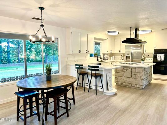 Dining room, Interior, Kitchen, Pendant Lights, Stainless Steel Appliances, Wood Texture Flooring