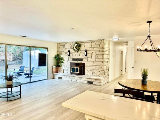 Chandelier, Dining room, Fireplace, Interior, Stone Walls, Wood Texture Flooring