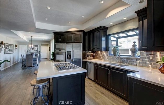 Chandelier, Dining room, Interior, Kitchen, Pendant Lights, Recessed Lighting, Stainless Steel Appliances, Wood Texture Flooring