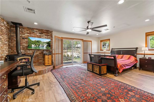 Bedroom, Fireplace, Home Office, Interior, Recessed Lighting, Stone Walls, Wood Texture Flooring