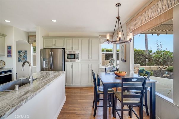 Dining room, Interior, Kitchen, Pendant Lights, Recessed Lighting, Stainless Steel Appliances, Wood Texture Flooring