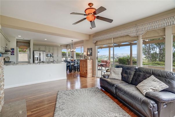 Chandelier, Dining room, Interior, Kitchen, Living room, Pendant Lights, Recessed Lighting, Stainless Steel Appliances, Wood Texture Flooring