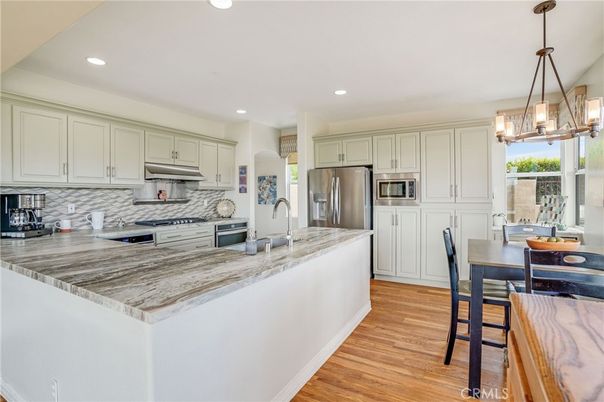 Dining room, Interior, Kitchen, Pendant Lights, Recessed Lighting, Stainless Steel Appliances, Wood Texture Flooring